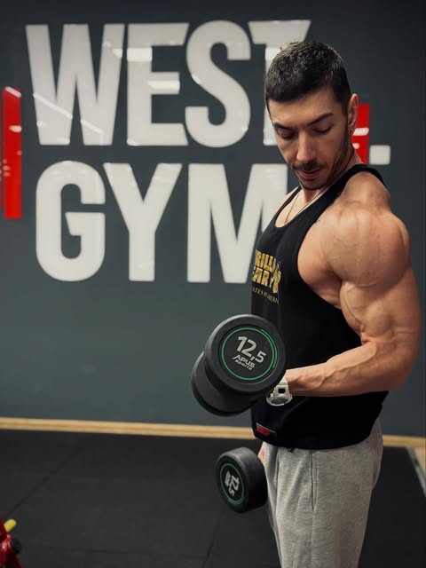 Martin Iliev training with a dumbbell